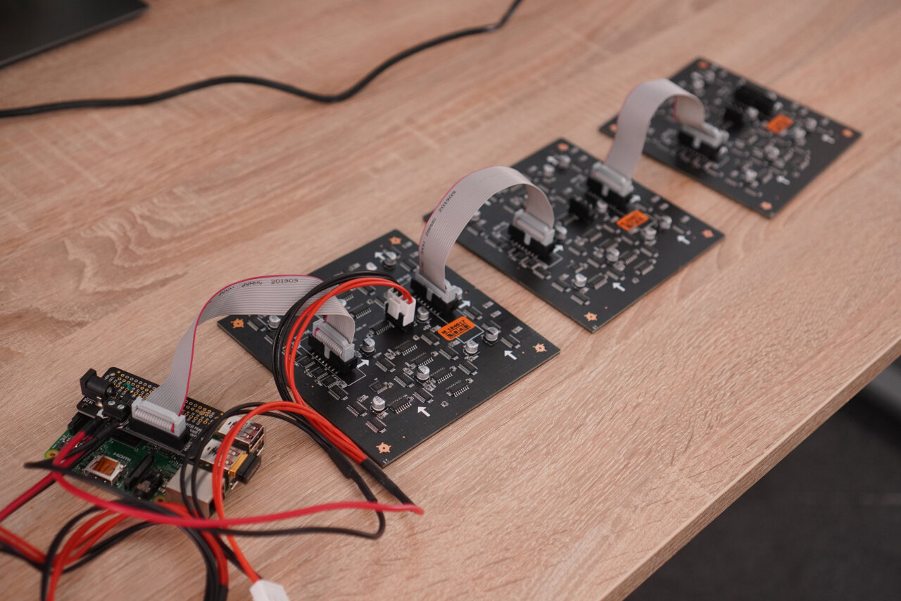 Photo of the Raspberry Pi 2 with the Adafruit RGB Matrix Bonnet connected to the three LED panels.