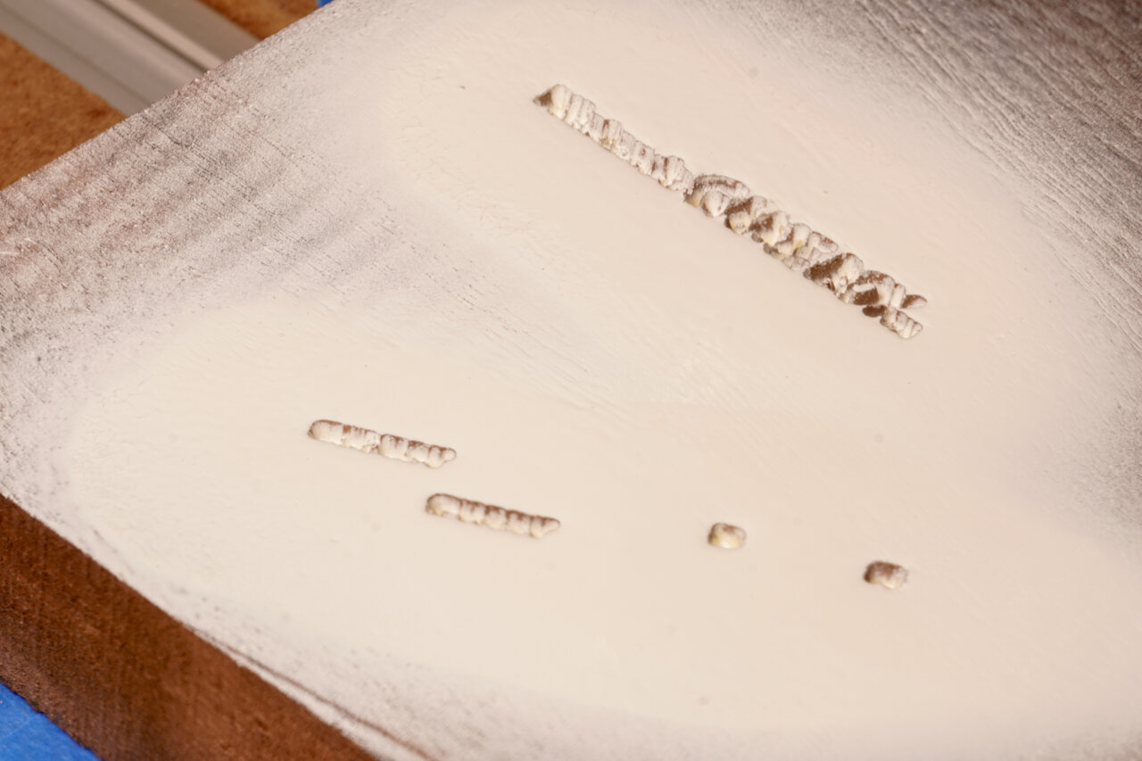Photo of the workpiece covered in white paint.