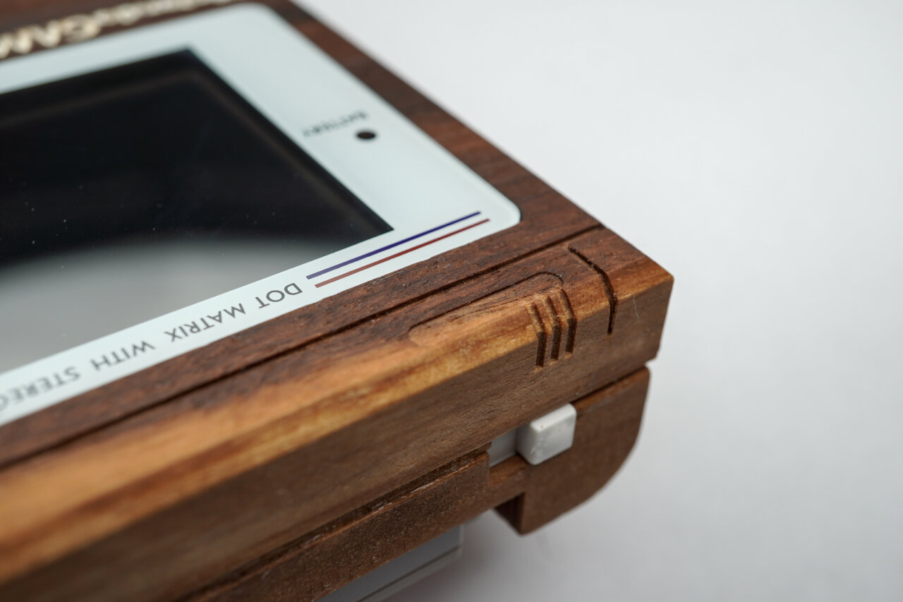 Detail photo of the power switch and decorative lines on the case next to the power switch.